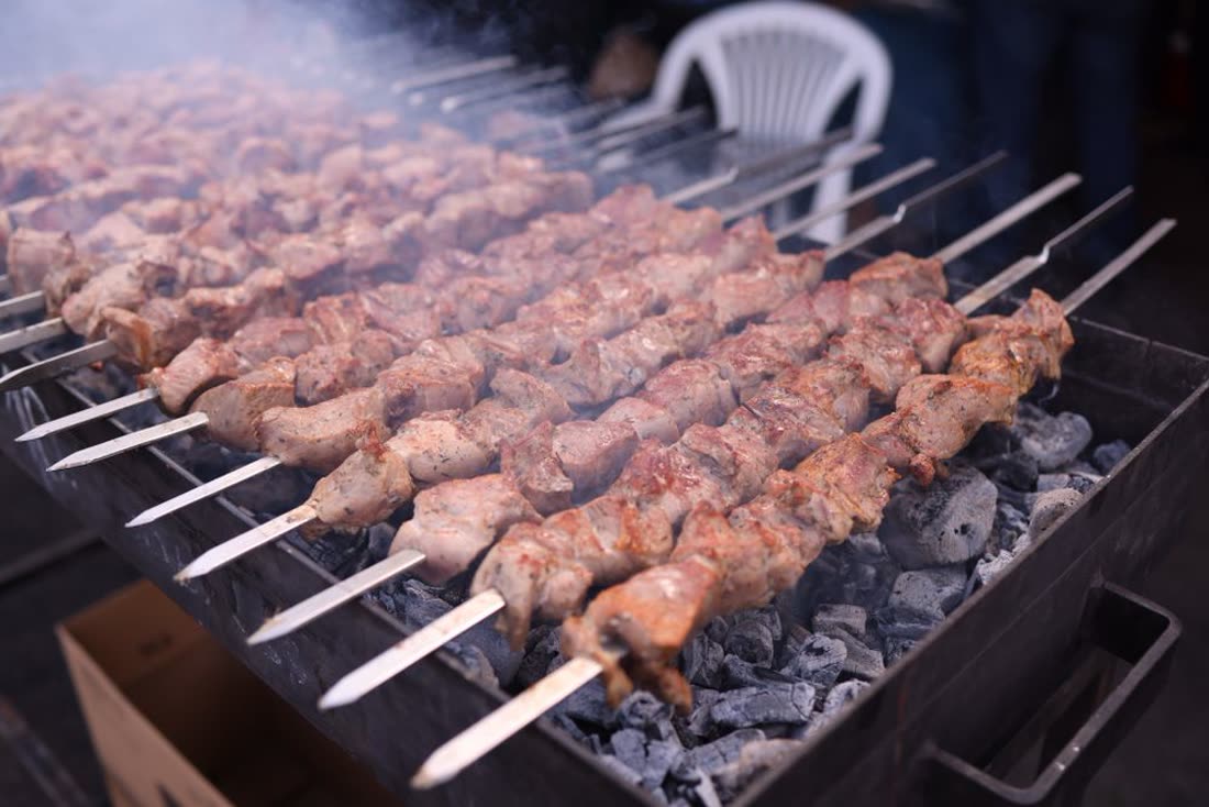 Kabab skewers grilling over charcoal