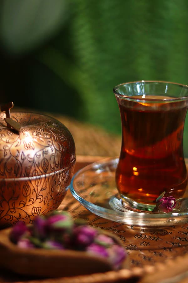 Persian tea in an estekan glass with copper service